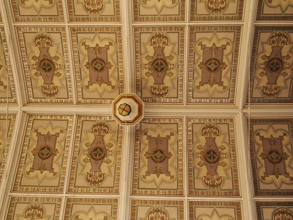 Decorative painting of saints on large ceiling tiles 