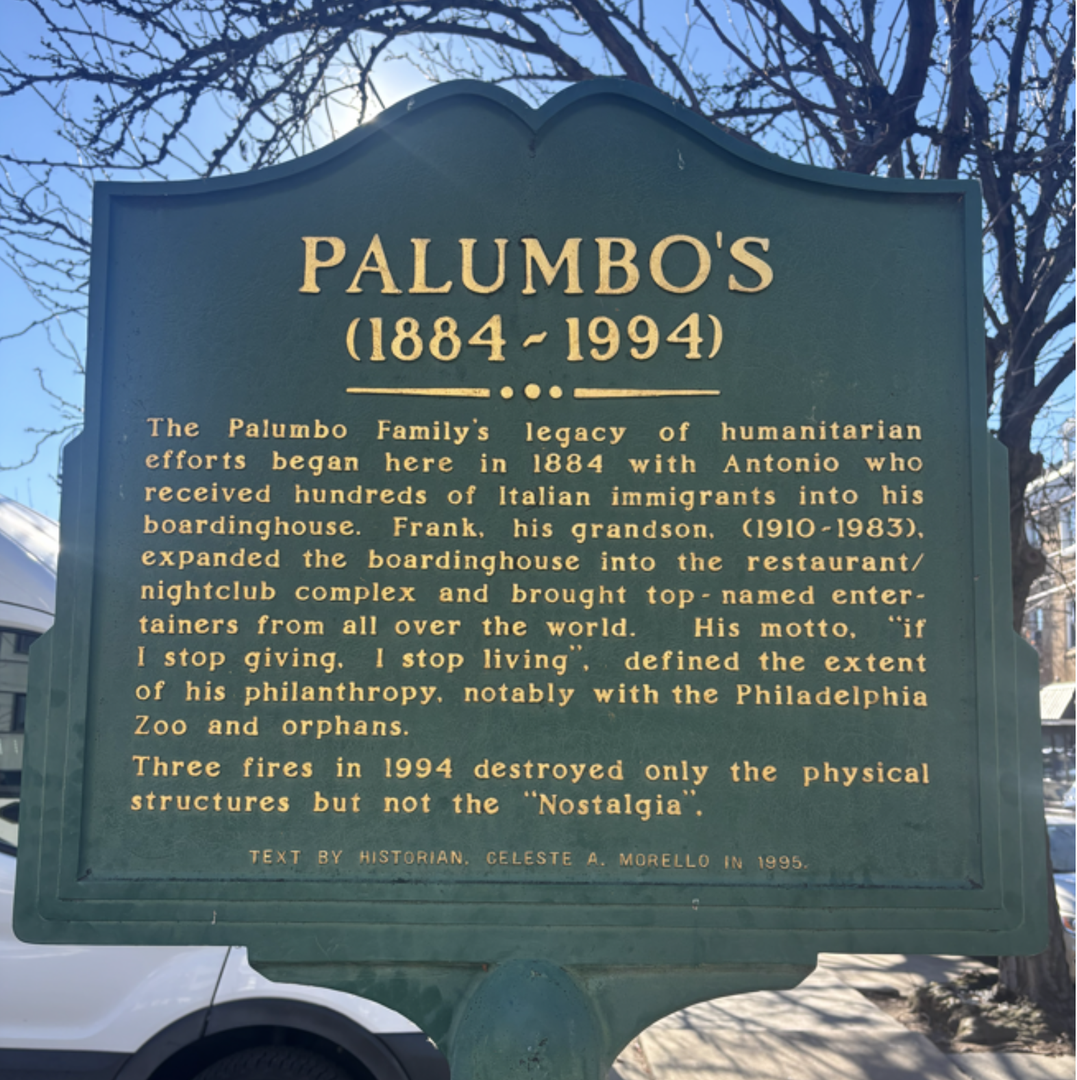 Green historical marker with gold text.