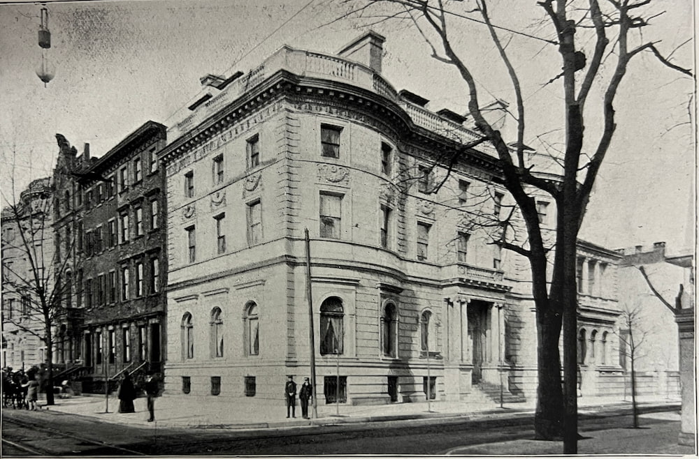 Black and white image of three story 19th c stone mansion