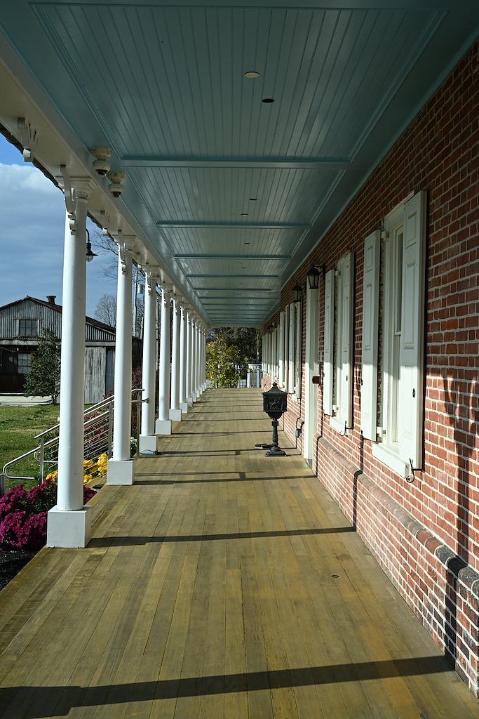 Colonnaded Porch on the south side of the Main Building looking west.