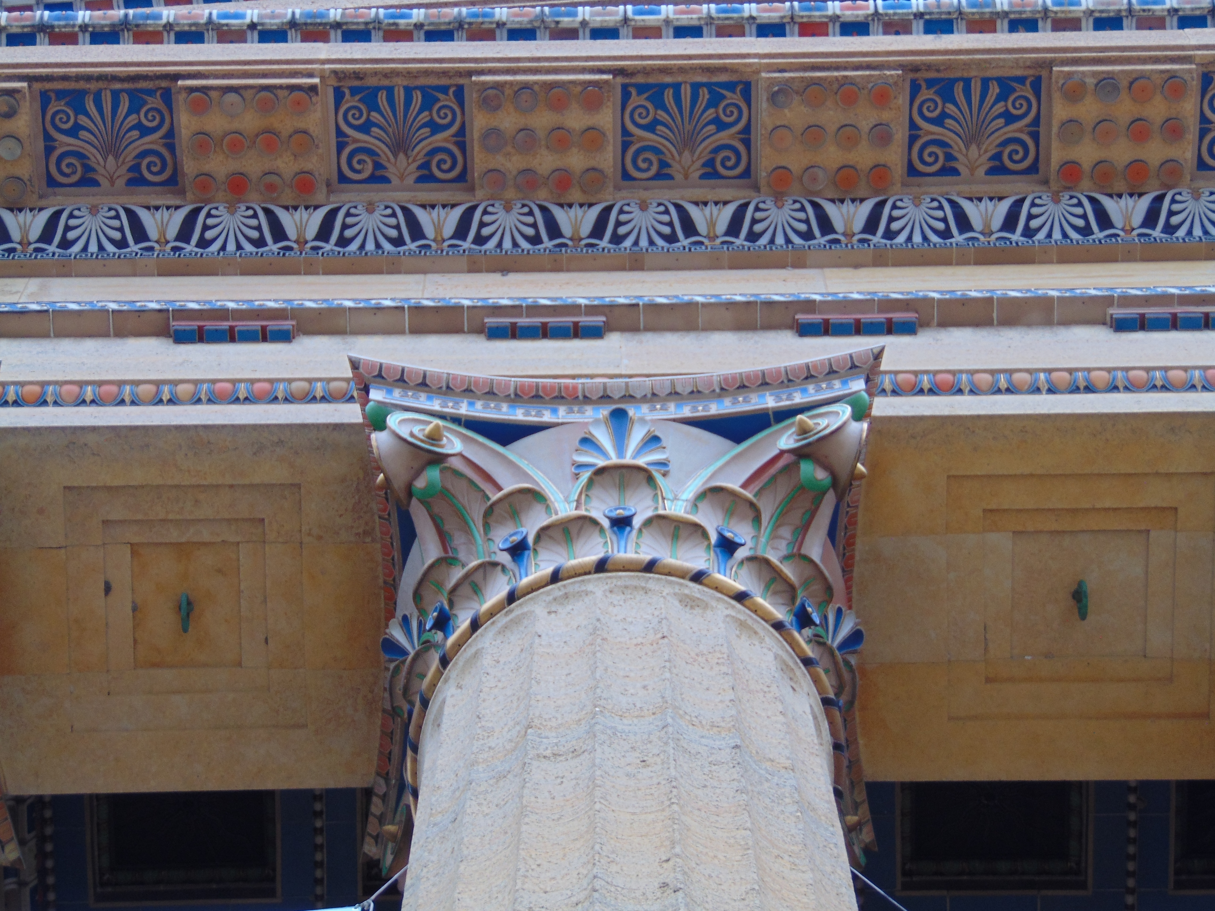 Corinthian column with red, green, and blue detailing.