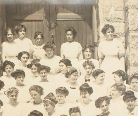 Black and white photo of Hoshino Ai in front of Taylor Hall with other members of her class