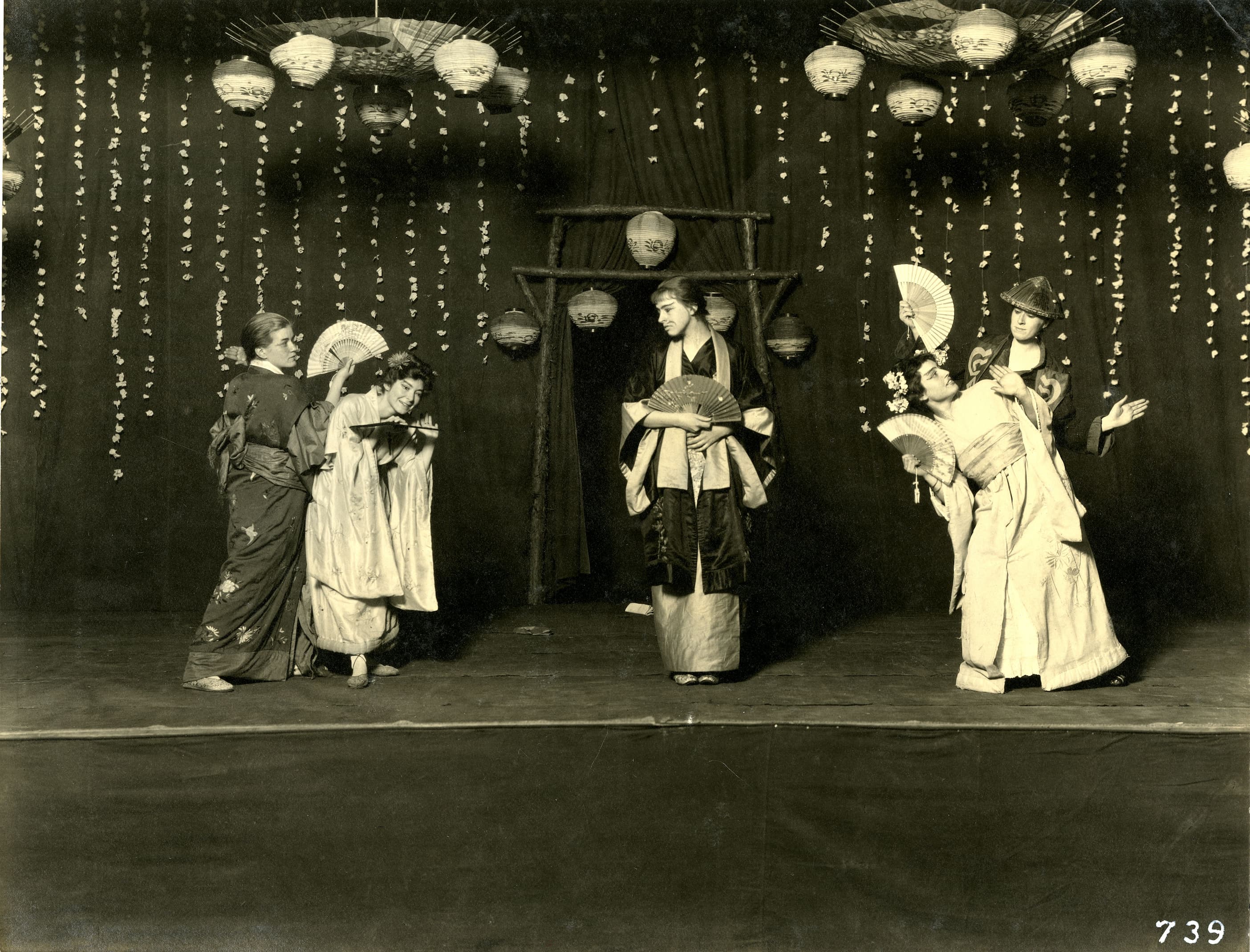 White Bryn Mawr students dressed up in Japanese attire for the Glee Club's prodcution of The Mikado, a satirical play mocking Japanese people.